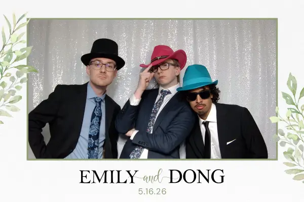 Group of guys pose with hats
